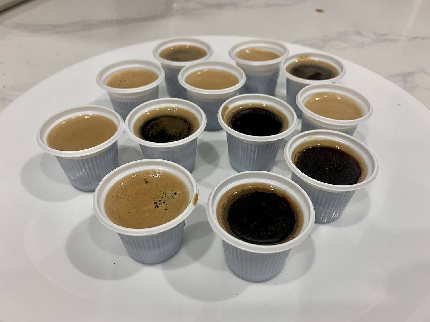 A tray of small cups of Cuban coffee