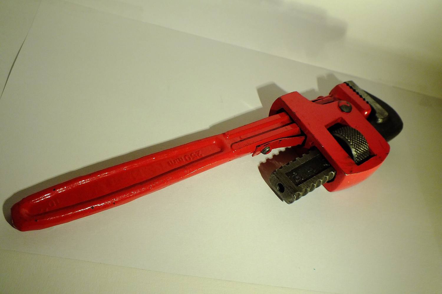 A red pipe wrench