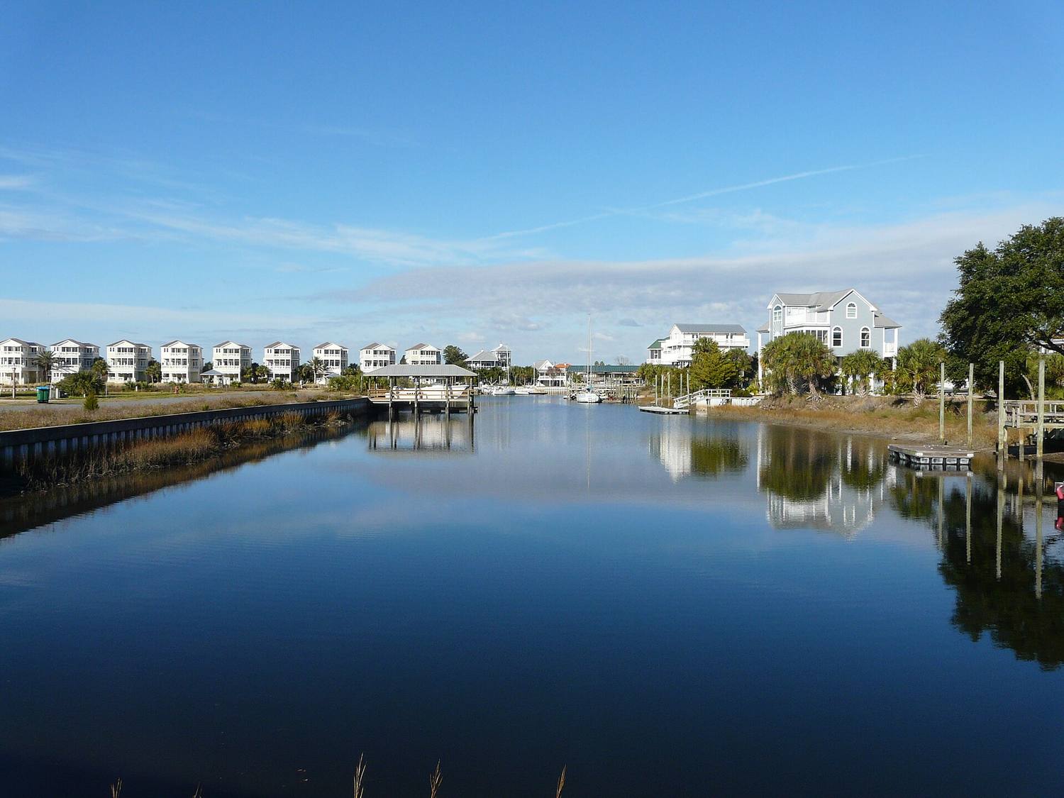 A quiet canal lined with docks and homes
